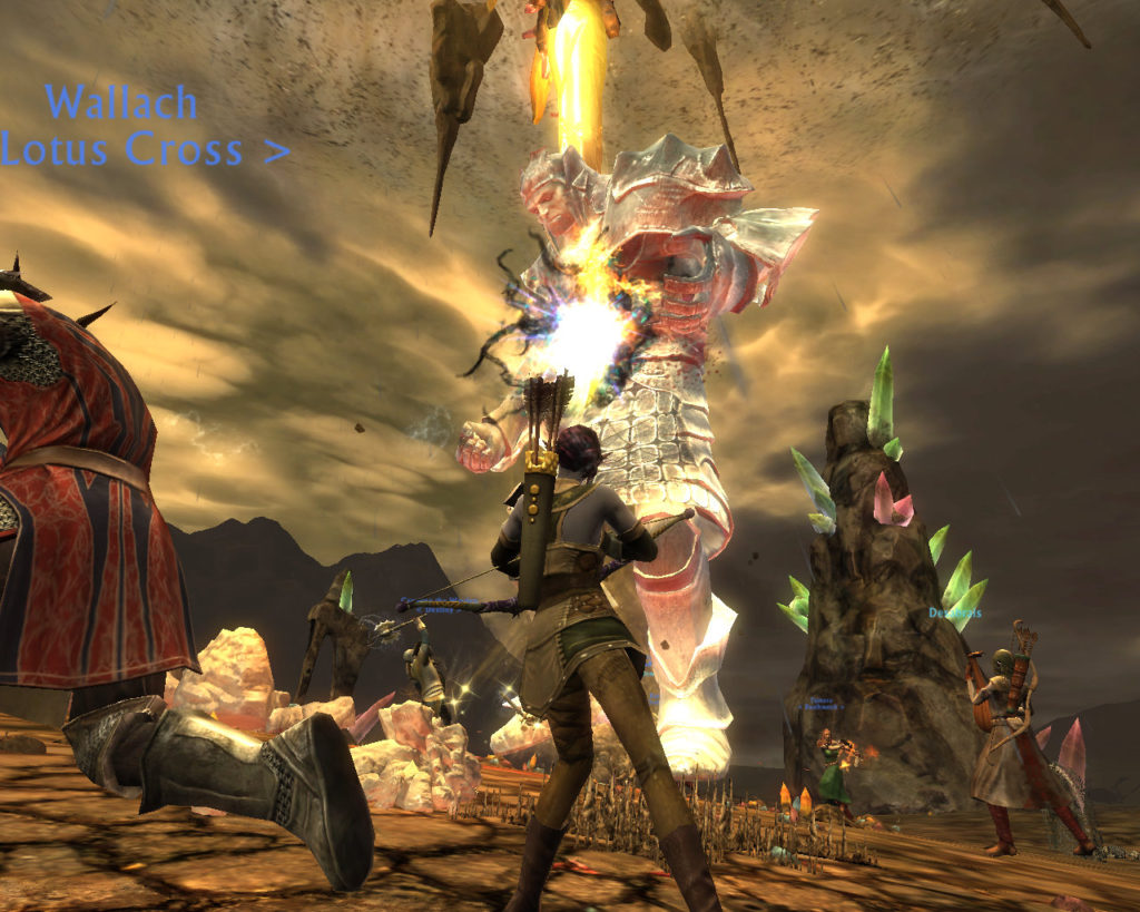 Adventurers in the MMO Rift attack a giant.